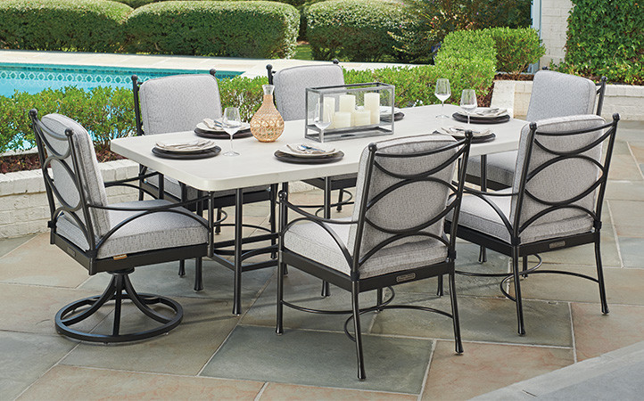 Outdoor dining scene featuring dining chairs and table.