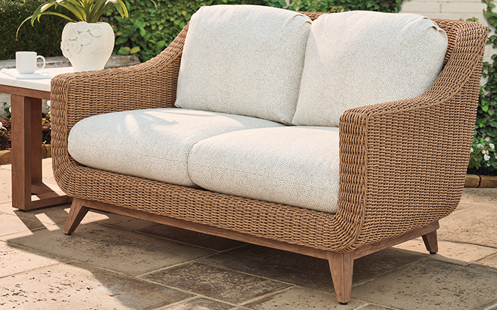 Outdoor living room scene with sofa.