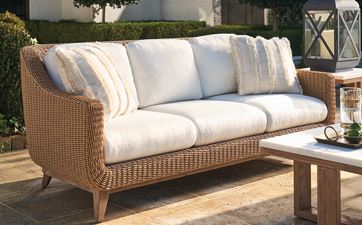 Outdoor living room scene with sofa.