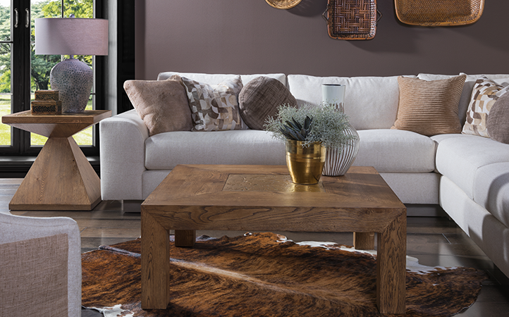 Barnaby living room scene featuring sofa, square cocktail table, and end table.