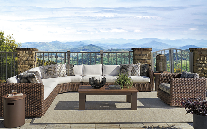Kilimanjaro living room scene featuring a sectional, chair, cocktail table and end tables.