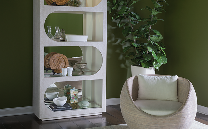 Solimar living room scene featuring bookcase and swivel chair.