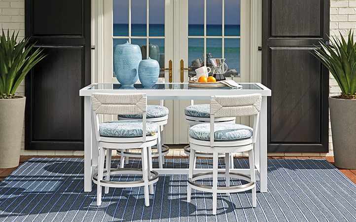 Ocean Breeze Promenade scene featuring dining table with chairs.