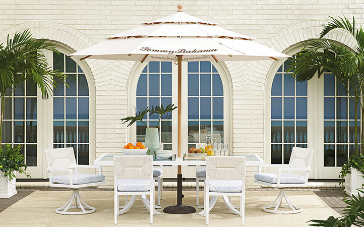 Ocean Breeze Promenade scene featuring dining table with chairs.